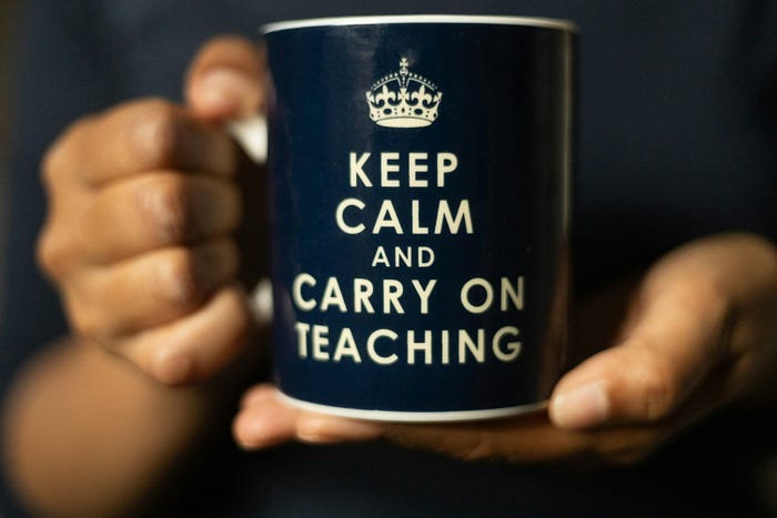 Close-up of a ‘Keep Calm and Carry On Teaching’ mug – motivational gift for educators and teachers.